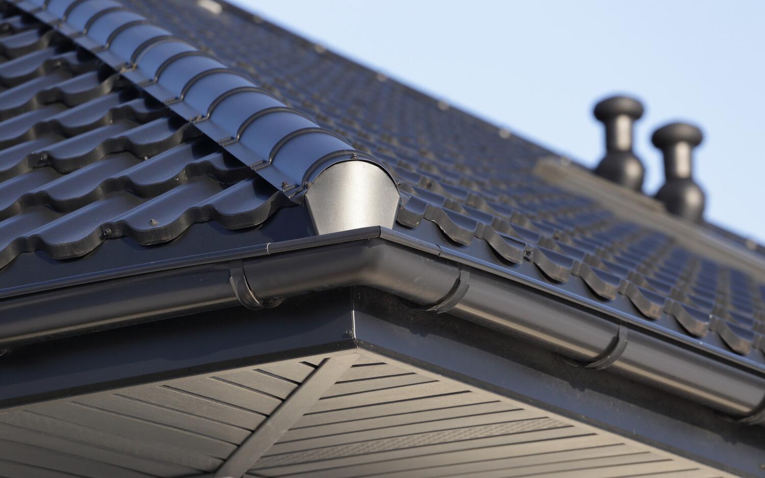 Seamless gutter running along a residential roofline